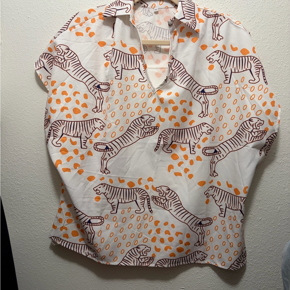 White blouse with tiger graphics